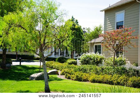 Beautiful House At Lake In Sunny Day, California