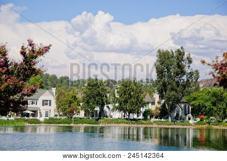 Beautiful House At Lake In Sunny Day, California