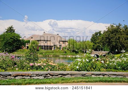 Beautiful House At Lake In Sunny Day, California