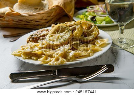 Italian American Chicken Francese With Farfalle Pasta And Side Salad