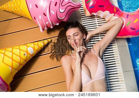 Secret, Enchantment, Summer Concept. Lying By The Outdoor Swimming Pool Woman Had Dark Hair And Foxy