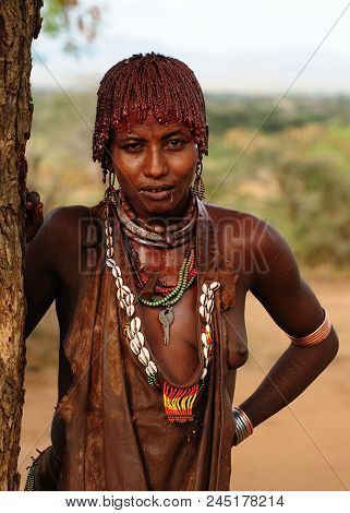 Turmi, Omo Valley, Ethiopia - 29 July 2013: Portrait Of The Woman From Hamer People Resting Under Th