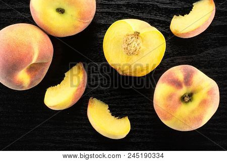 Yellow Peaches Flatlay Collection On Black Wood Background