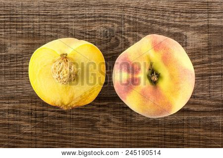 One Yellow Peach And A Half With A Drupe Flatlay On Brown Wood Background