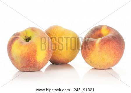 Three Yellow Peaches Isolated On White Background