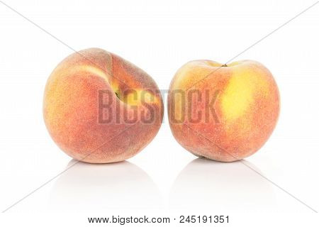 Two Yellow Peaches With A Red Blush Isolated On White Background