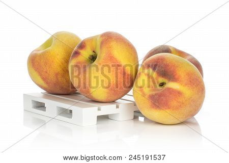 Yellow Peaches On A Wooden Pallet Isolated On White Background