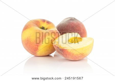 Two Ripe Yellow Peaches And One Half Without Drupe Isolated On White Background