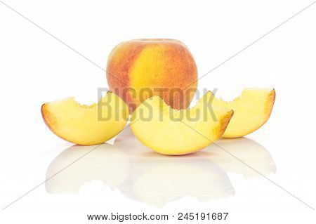 One Yellow Peach And Three Slices Isolated On White Background