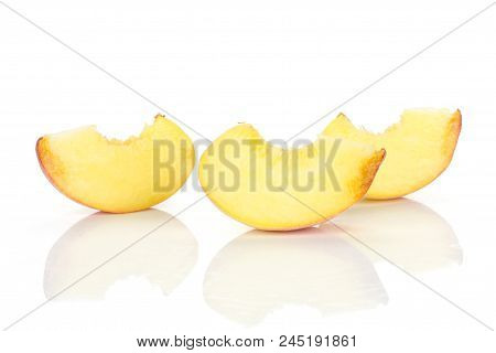 Three Yellow Peach Slices Isolated On White Background