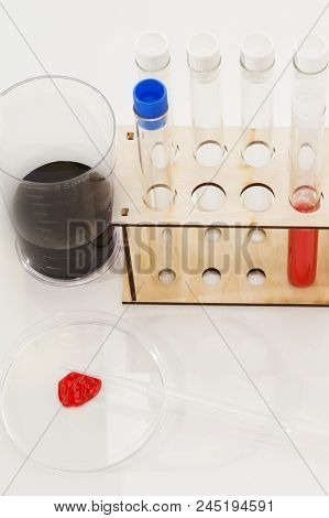 Lab Tube, Eppendorfs With Red Liquid. White Background. Studio Shot