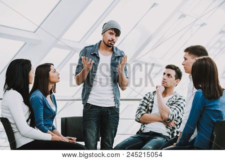 Young Bearded Man Shares Problems With Other People. People In Circle Listen To Man.support Group.