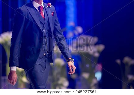 Sofia, Bulgaria - 28 March 2018: Male Model Walks The Runway In Blue Suit During A Fashion Show. Fas