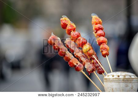 Stall With Caramelized Fruit On Stick On Street Qianmen In Beijing City. Qianmen Street Runs South F
