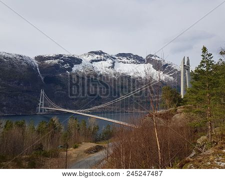 A Long Bridge Across The Hardangerfjord In Norway