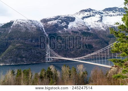 A Long Bridge Across The Hardangerfjord In Norway