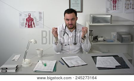 Very Emotional Bearded Doctor Talking To Camera Very Omnious