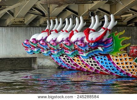 Kaohsiung, Taiwan -- June 10, 2018: A Row Of Dragon Boats With The Traditional Figureheads Is Being 