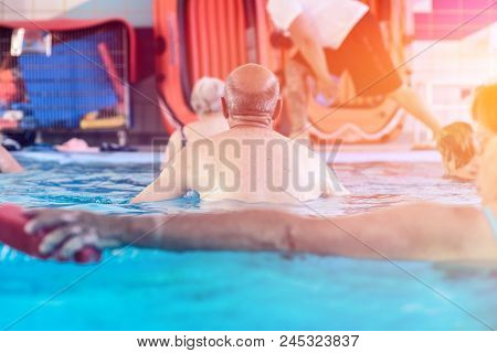 Group Or Young And Senior People In Aquarobic Fitness Swimming Pool Exercising Water Sport