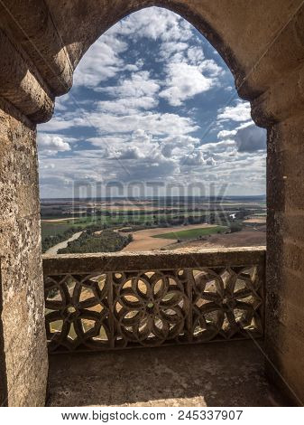 Almodovar Del Rio, Cordoba, Spain - June 9, 2018: Ogival Arch Of Balcony In A Tower, Landscape Of Co