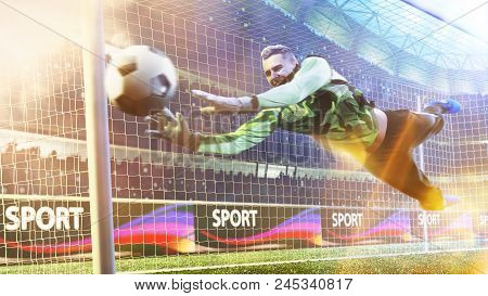 Goalkeeper Catches The Ball In The Football Stadium