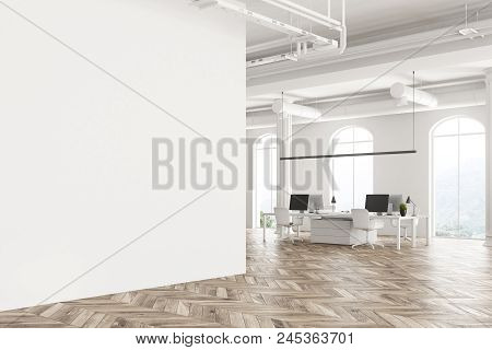 Modern Company Office Interior With White Computer Tables, Arched Windows And A Wooden Floor. Concep