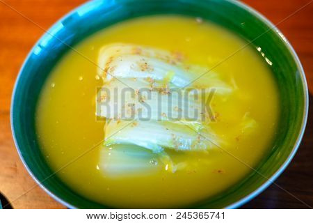 Seasonal White Bok Choy Cabbage Cooked In  A Duck Bouillon Served In Porcelain