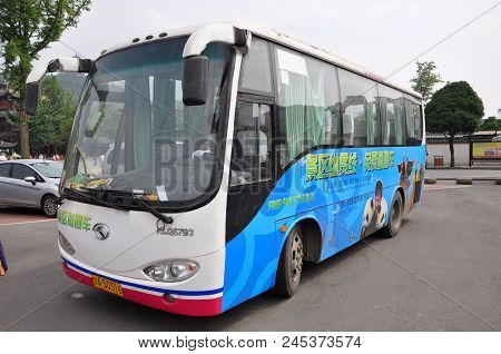 Dujiangyan, Sichuan, China - Jun. 21, 2012: Tour Bus In Dujiangyan Scenic Area, Sichuan Province, Ch