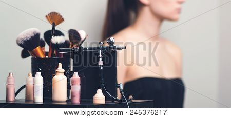 Makeup Airbrush And The Bottles With Paint For Body Art.
