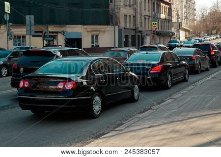 Narrow City Oad With Cars In Traffic Jam. Red Traffic Light.