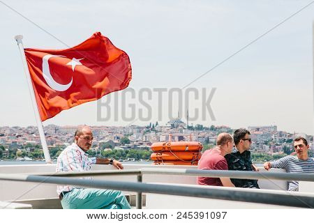 Istanbul, June 17, 2017: Local Residents Move On Water By Ferry Or Passenger Boat. A Man Sits Next T
