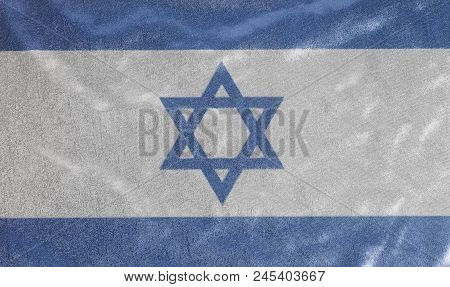 Flag Of Israel On Jeans Denim Texture Background Close Up .