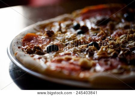 Hot Appetizing Pizza On The Table In Bar