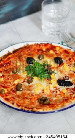 Deicious Pizza On The Table With Colorfull Background
