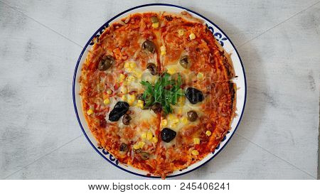 Deicious Pizza On The Table With Colorfull Background