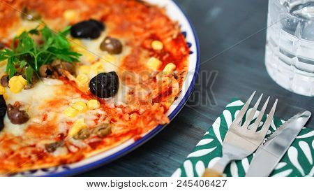 Deicious Pizza On The Table With Colorfull Background