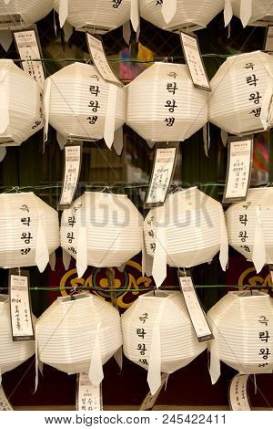 SEOUL-SOUTH KOREA, MAY 20, 2018:  Close up of the lanterns with wishes at Jogyesa Temple.  It is one of the most important Buddhist temples in Korea with traditional hanji paper lanterns 