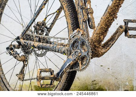 Mountain Bike Transmission In Mud. Dirty Chain Drive Of Mountain Bike After Riding In Bad Weather
