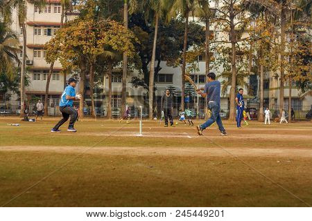Men Playing Cricket With Tennis Ball At Mumbai Grounds
