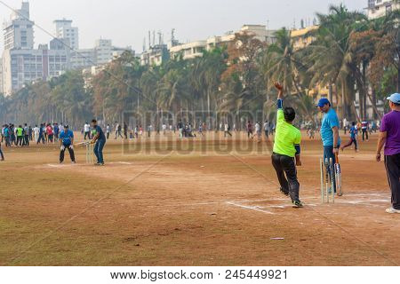 Men Playing Cricket With Tennis Ball At Mumbai Grounds