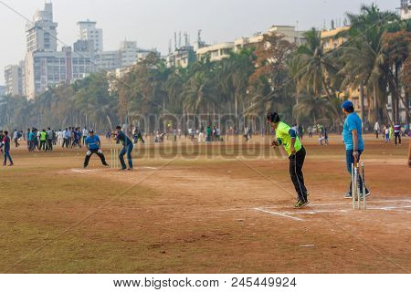 Men Playing Cricket With Tennis Ball At Mumbai Grounds