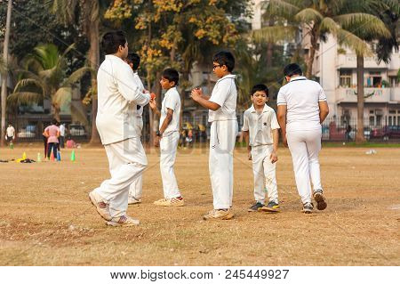 Indian Kids Practicing At Cricket Net To Improve Cricketing Skills