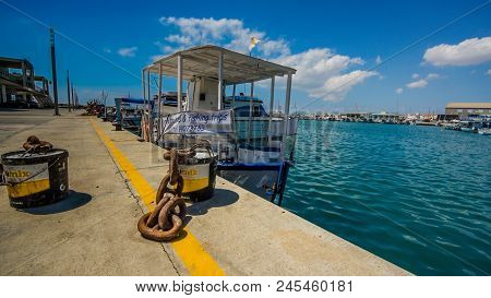 The Old Fishing Boats Are Waving On The Waves. Shipyard  In Limassol, Cyprus,  August 2017
