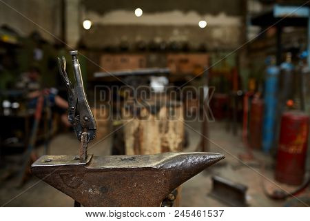 Big Heavy Anvil And Pliers In The Blacksmith's Workshop, Close-up, Selective Focus.