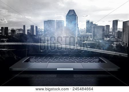 Laptop and construction concept. Mixed media