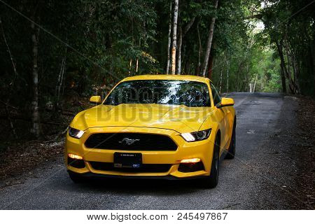 Xpujil, Mexico - May 19, 2017: Yellow Muscle Car Ford Mustang At The Countryside.