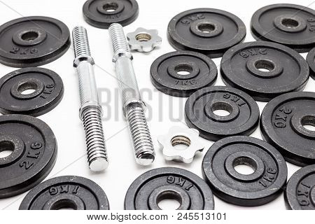 Black Metal Weights 1kg And 2kg On White Background.
