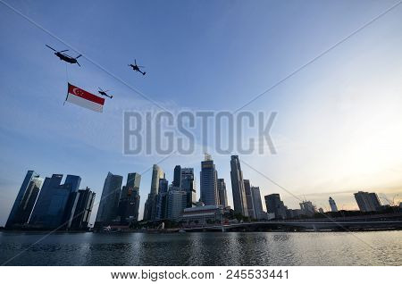 Singapore-june 17, 2018: The Flypast Of The Singapore Flag During The National Day Parade Practice. 