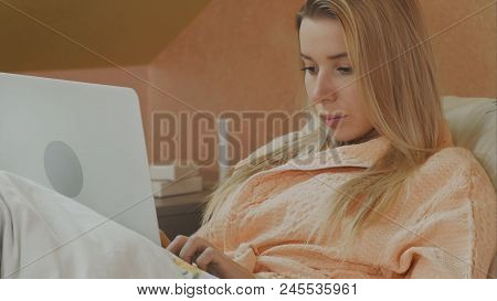 A Sick Patient Lying In A Hospital Bed With A