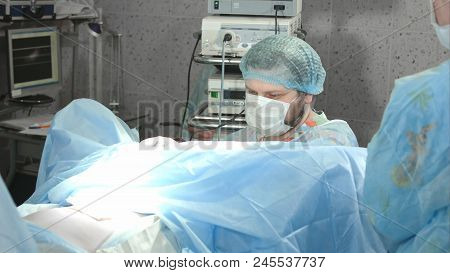 Medical Team Performing Operation In Hospital. Close Up. Professional Shot